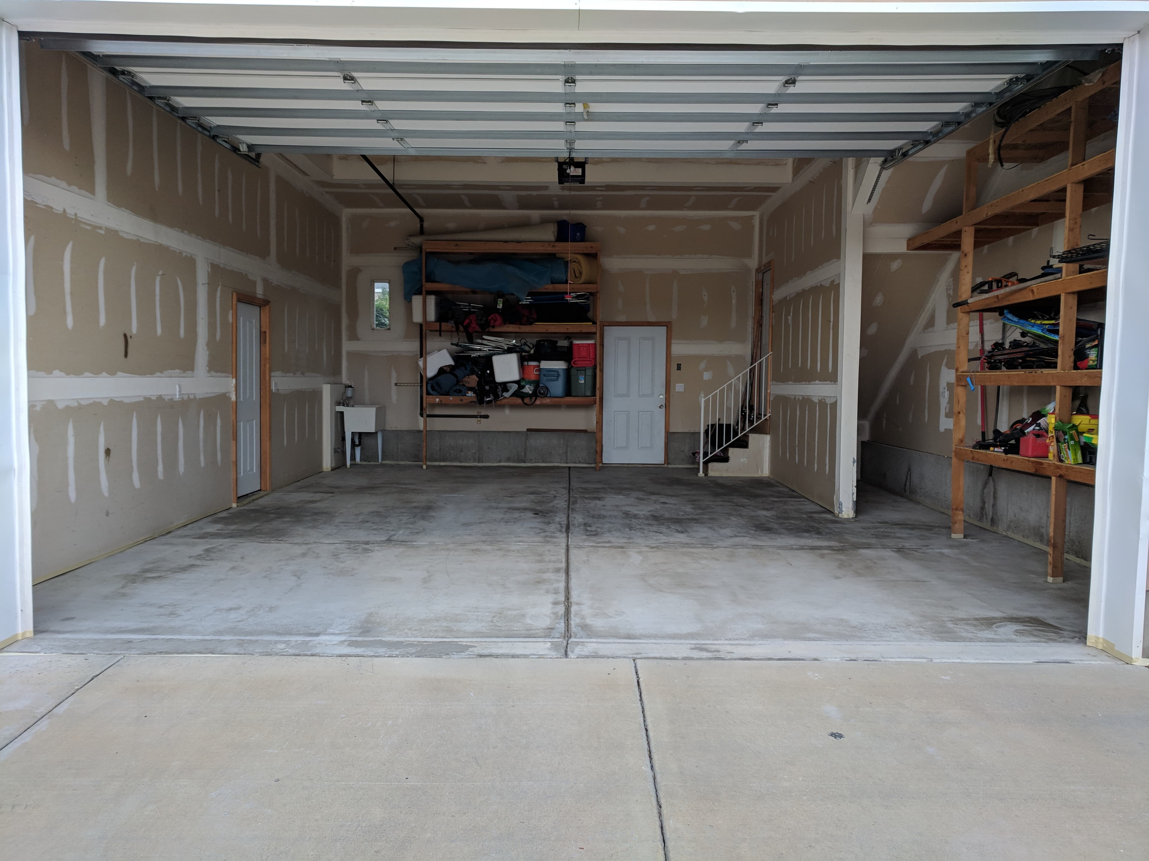 Worn Draper garage slab before Bella Rocca installed a full-flake floor