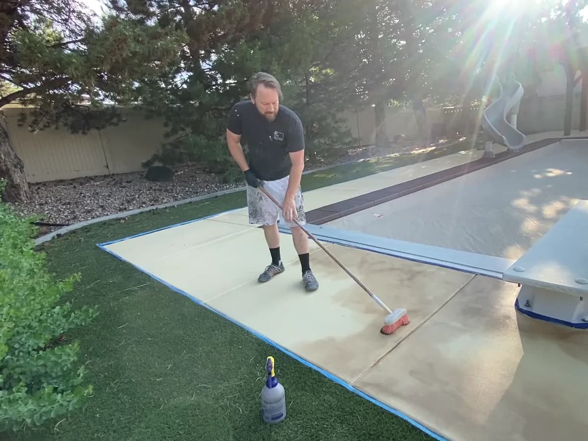 Grant Langston working on a pool-deck surface