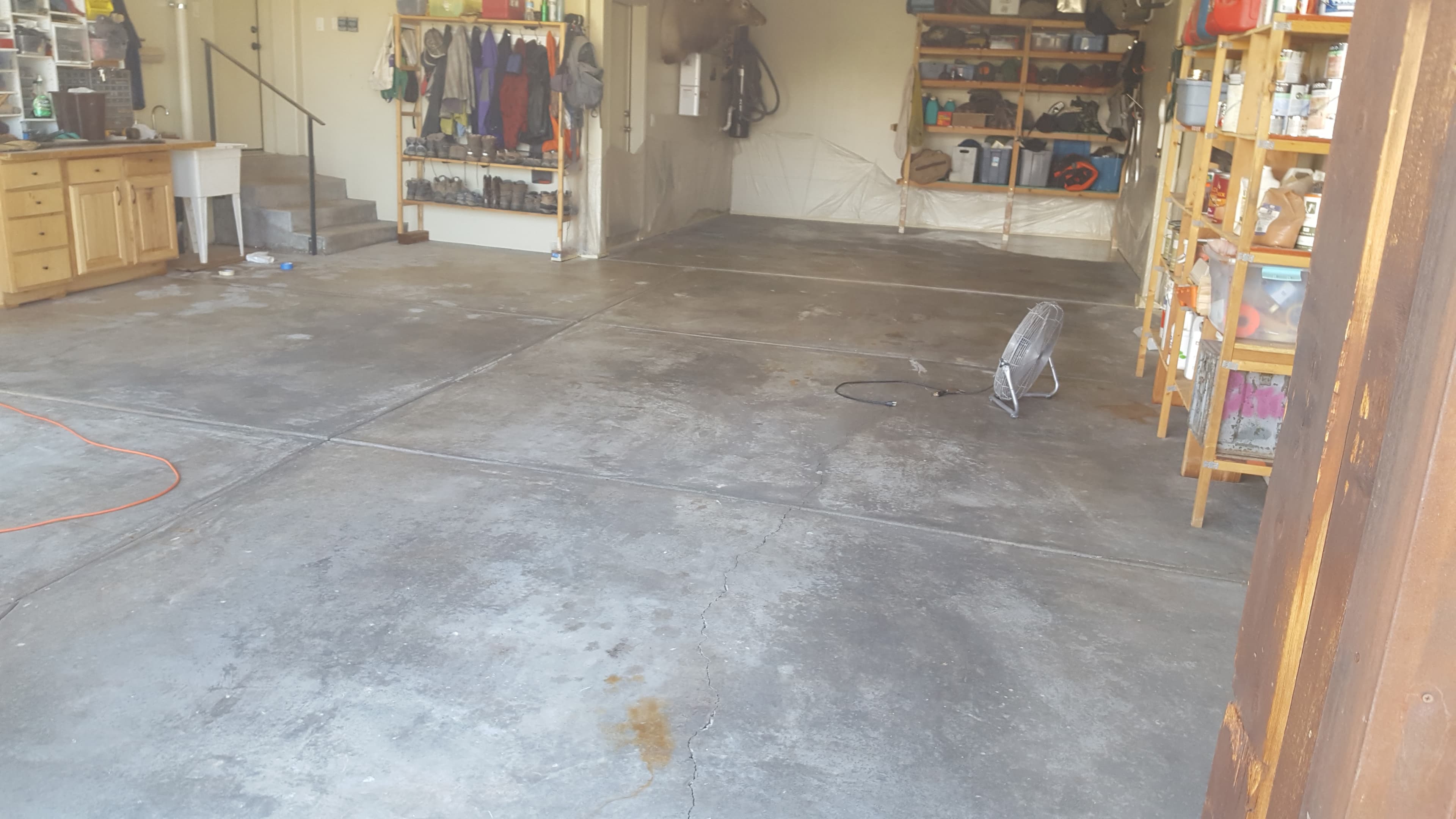 Residential garage slab before Bella Rocca applied a layered stained-concrete finish