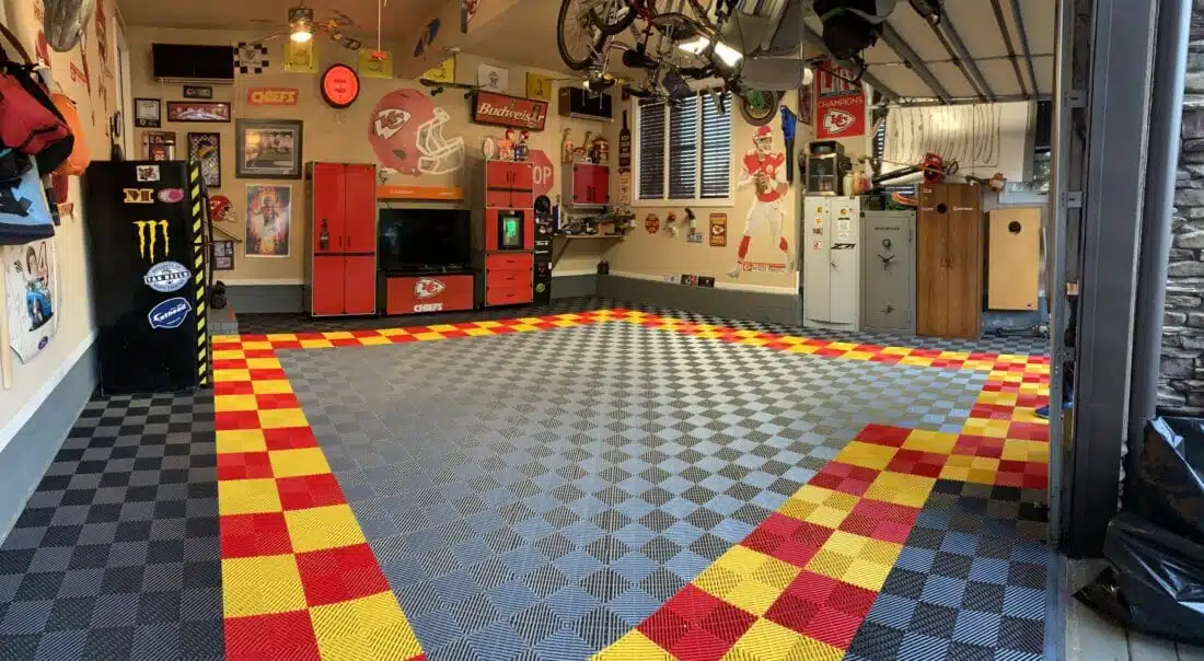 Close view of ribbed modular garage flooring installed in a working garage